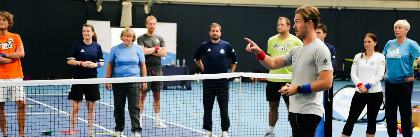Ashley Neaves coaching a group on court